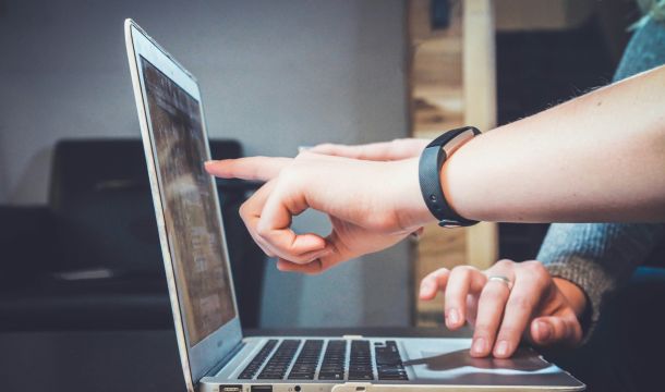 pointing to computer