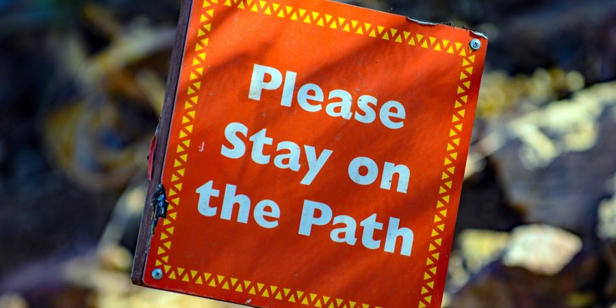 sign: please stay on the path